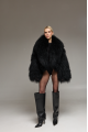 Women's short black fur coat made of natural llama fur